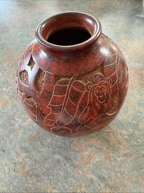 Pottery Vase carved in Costa Rica from local artist. Dated 2011.  Brick red.